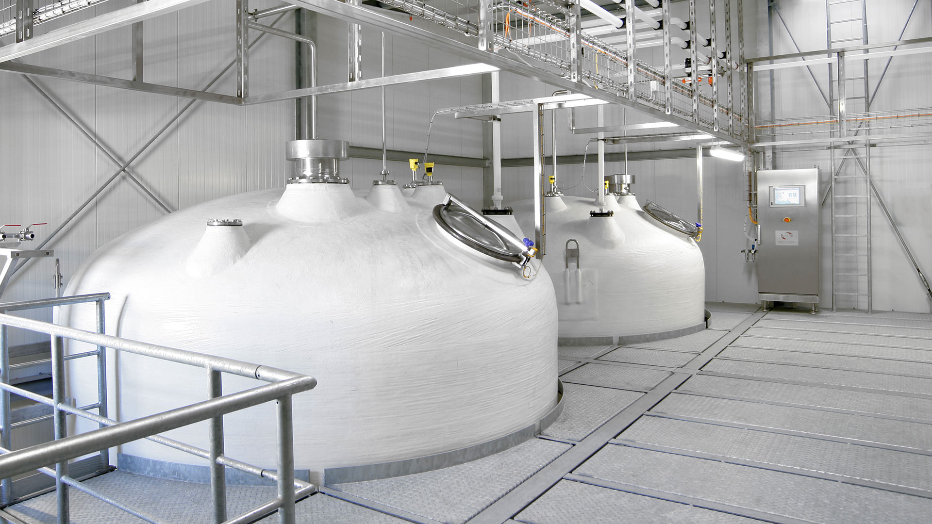 photo of two storage tanks for liquid seasoning